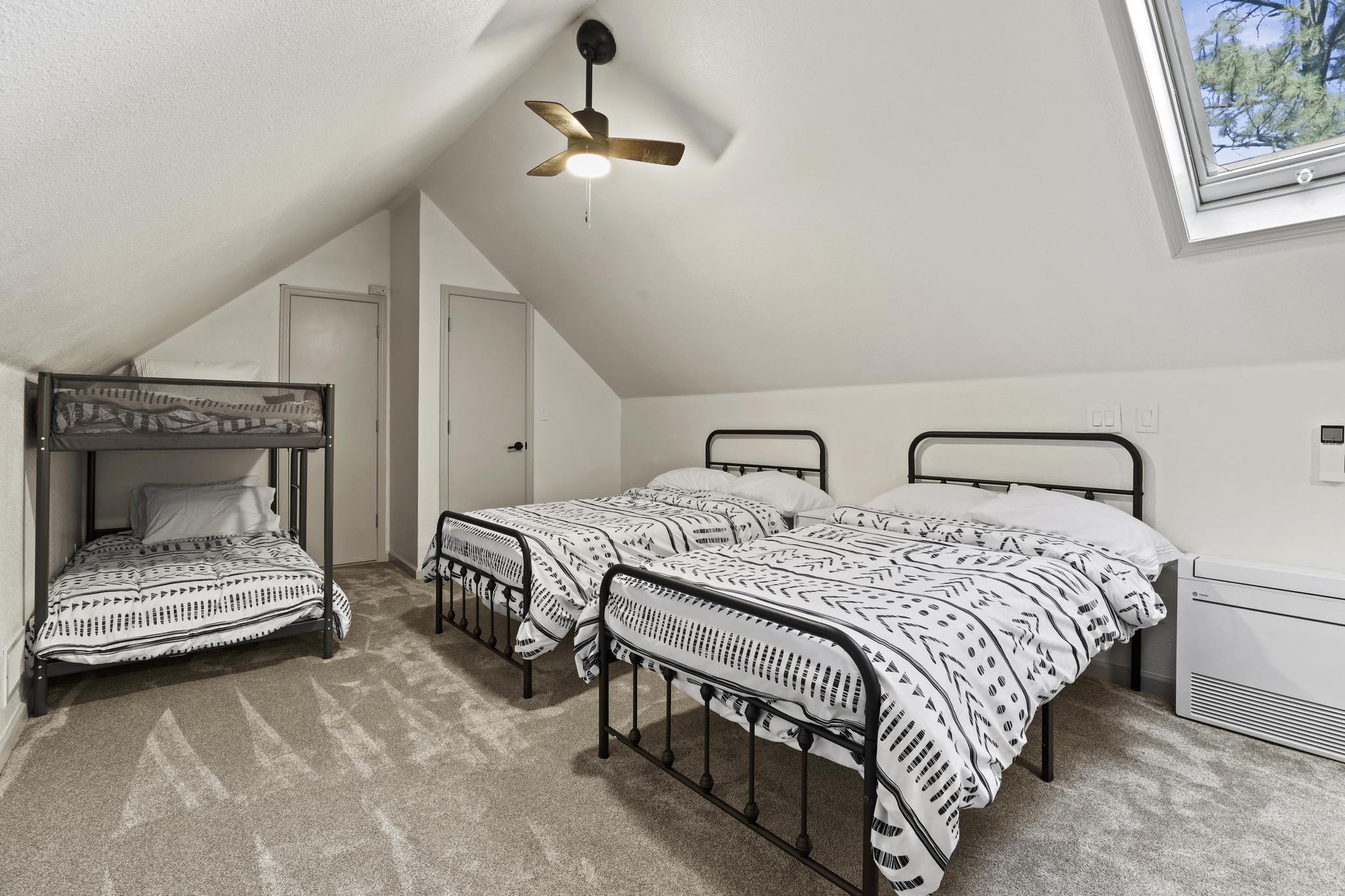 Loft bedroom with multiple beds for larger groups