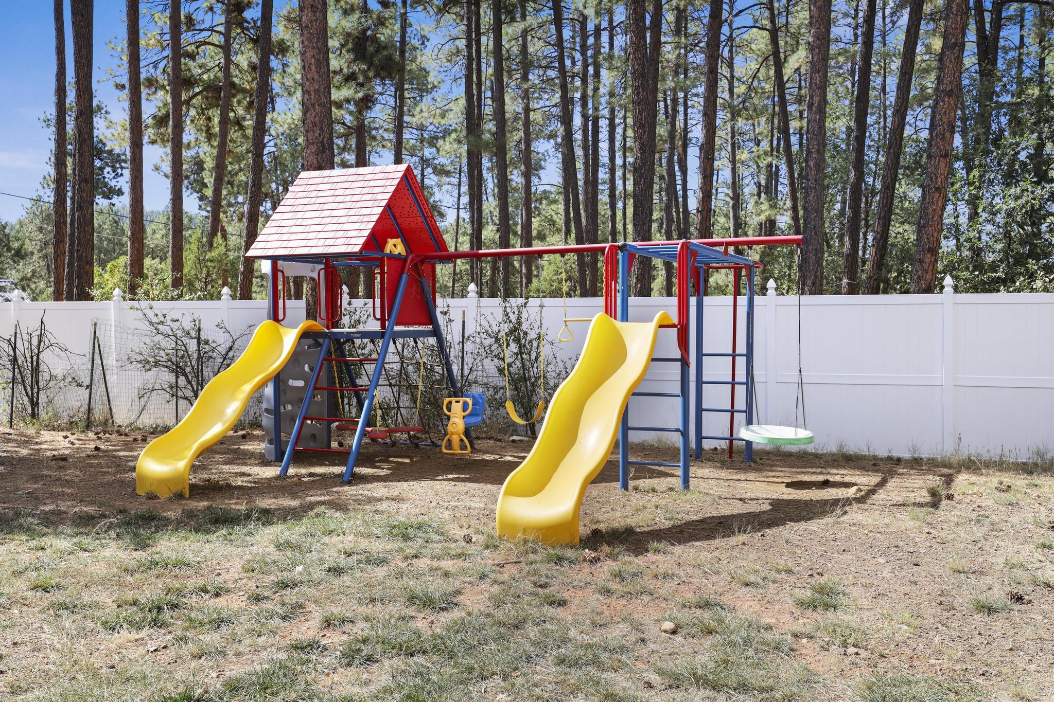 Primary suite bedroom with king bed and seating area